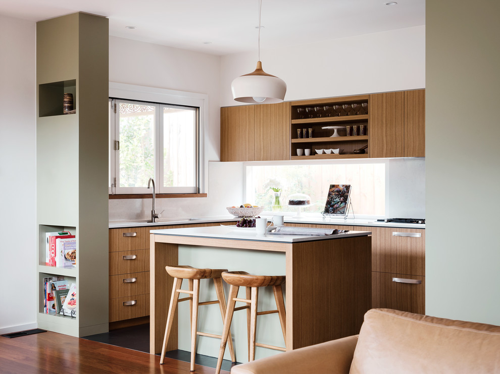 Design ideas for a mid-sized contemporary u-shaped eat-in kitchen in Melbourne with a double-bowl sink, quartz benchtops, white splashback, stone slab splashback, stainless steel appliances and with island.