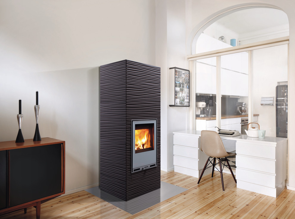 This is an example of a scandinavian living room in Gloucestershire with a wood stove.