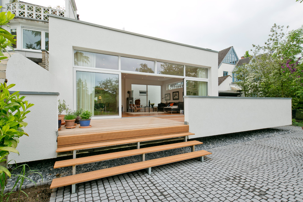 Photo of a large scandinavian deck in Dusseldorf with a container garden and no cover.