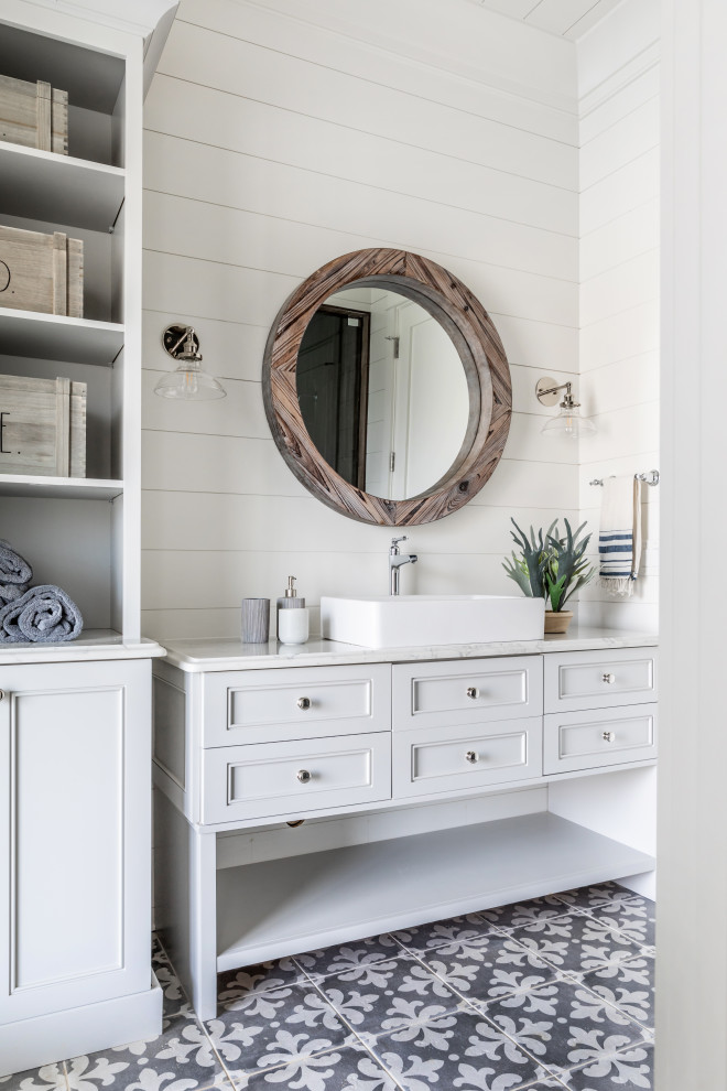 Beach style bathroom in Charlotte with recessed-panel cabinets, white cabinets, white walls, a vessel sink, grey floor, white benchtops, a single vanity, a freestanding vanity and planked wall panelling.