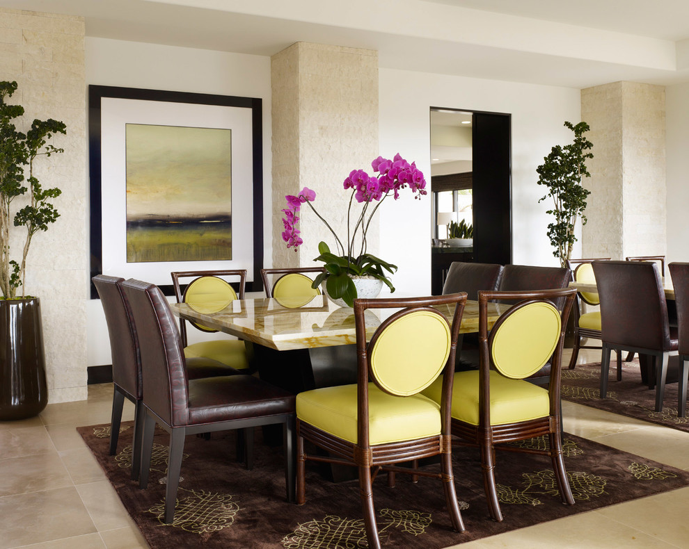 Tropical dining room in Los Angeles with white walls.