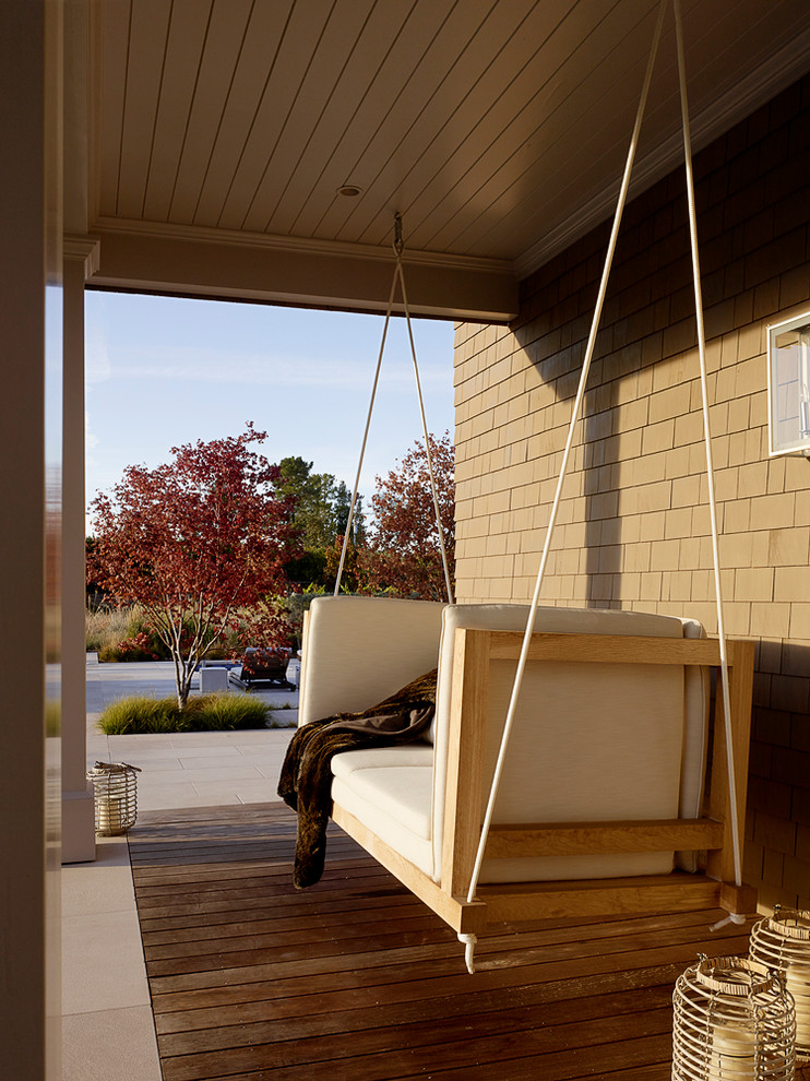This is an example of a transitional verandah in San Francisco with decking and a roof extension.