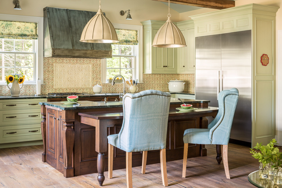 Inspiration for a beach style l-shaped kitchen in Portland Maine with green cabinets, multi-coloured splashback, stainless steel appliances, medium hardwood floors and with island.
