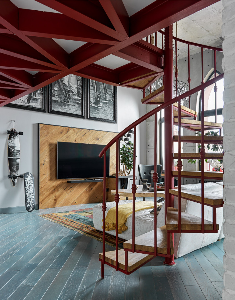 Inspiration for a medium sized industrial mezzanine living room in Moscow with white walls, medium hardwood flooring, a corner fireplace, a metal fireplace surround, a wall mounted tv and blue floors.