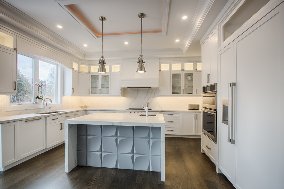Inspiration for a large contemporary l-shaped separate kitchen in Toronto with an undermount sink, shaker cabinets, white cabinets, marble benchtops, white splashback, marble splashback, panelled appliances, dark hardwood floors, with island, brown floor and white benchtop.