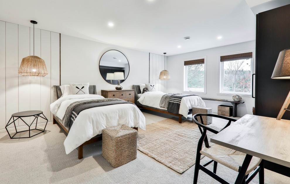 Large beach style guest bedroom in Montreal with white walls, carpet, beige floors and tongue and groove walls.