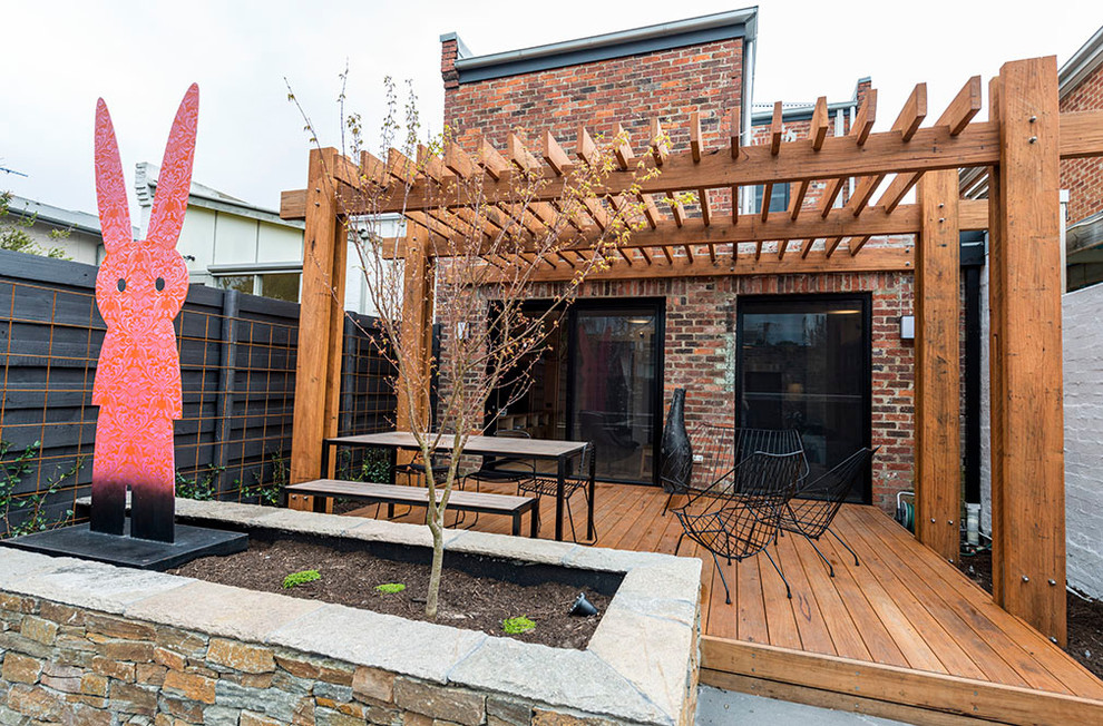 Design ideas for a small contemporary backyard patio in Melbourne with a vertical garden and no cover.