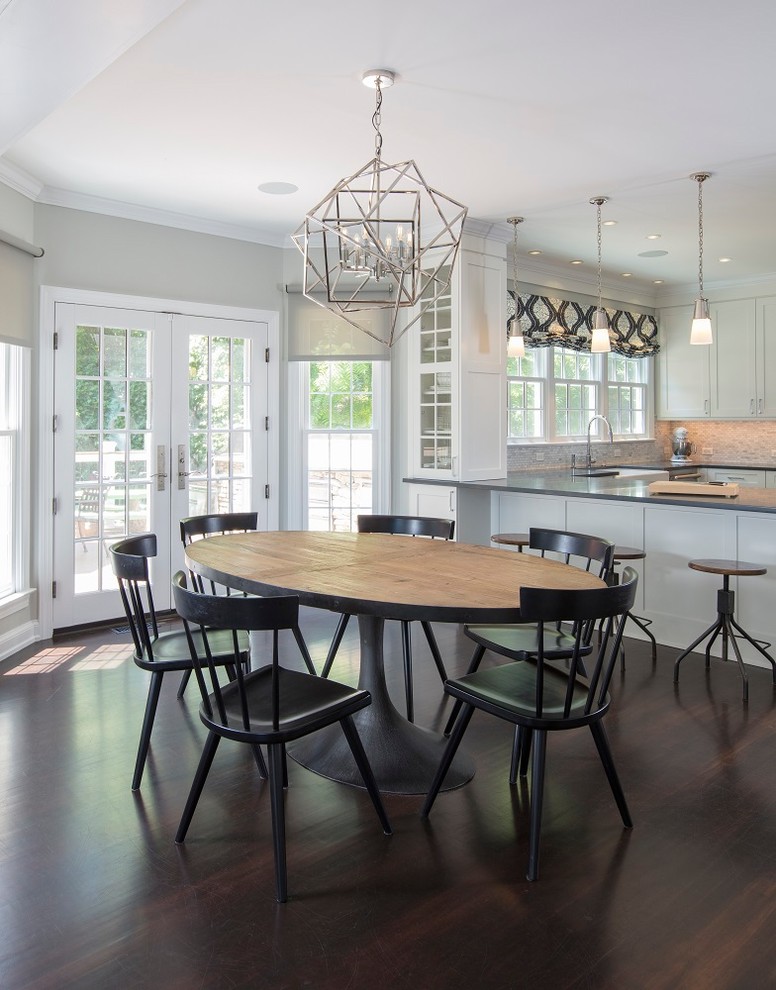 Design ideas for a large transitional u-shaped open plan kitchen in DC Metro with a farmhouse sink, recessed-panel cabinets, white cabinets, quartz benchtops, white splashback, marble splashback, stainless steel appliances, dark hardwood floors, a peninsula, brown floor and black benchtop.