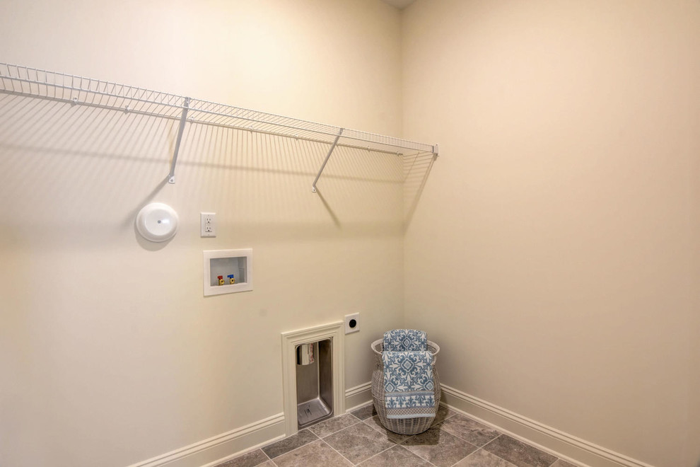 Design ideas for a small transitional dedicated laundry room in Other with white walls, ceramic floors and grey floor.