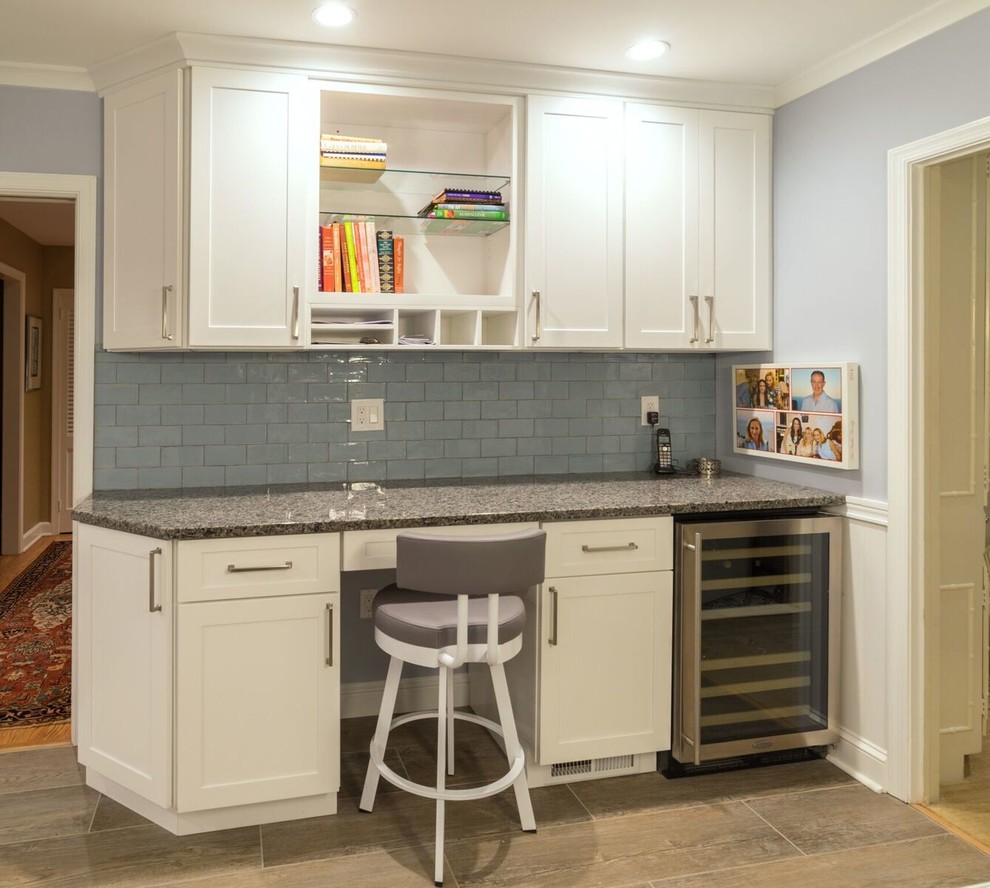 Mid-sized transitional u-shaped porcelain tile eat-in kitchen photo in Orange County with an undermount sink, shaker cabinets, white cabinets, granite countertops, blue backsplash, glass tile backsplash, stainless steel appliances and an island