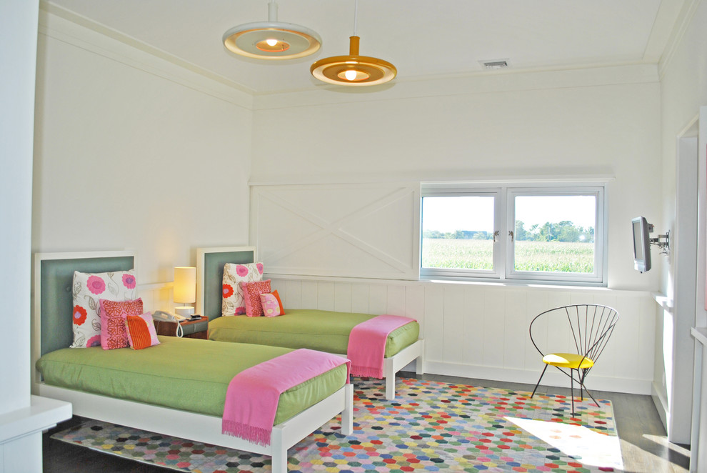 Inspiration for a country kids' bedroom for girls in New York with white walls and light hardwood floors.