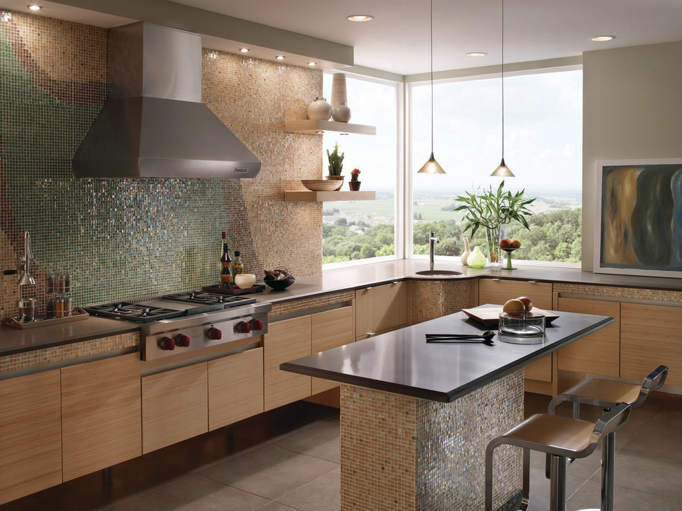 Kitchen - transitional l-shaped kitchen idea in Boston with an undermount sink, flat-panel cabinets, light wood cabinets, solid surface countertops, multicolored backsplash, mosaic tile backsplash, stainless steel appliances and an island