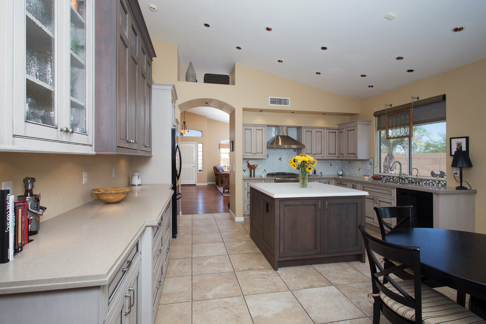 Large transitional l-shaped ceramic tile open concept kitchen photo in Phoenix with an undermount sink, beaded inset cabinets, gray cabinets, quartz countertops, white backsplash, glass tile backsplash, black appliances and an island