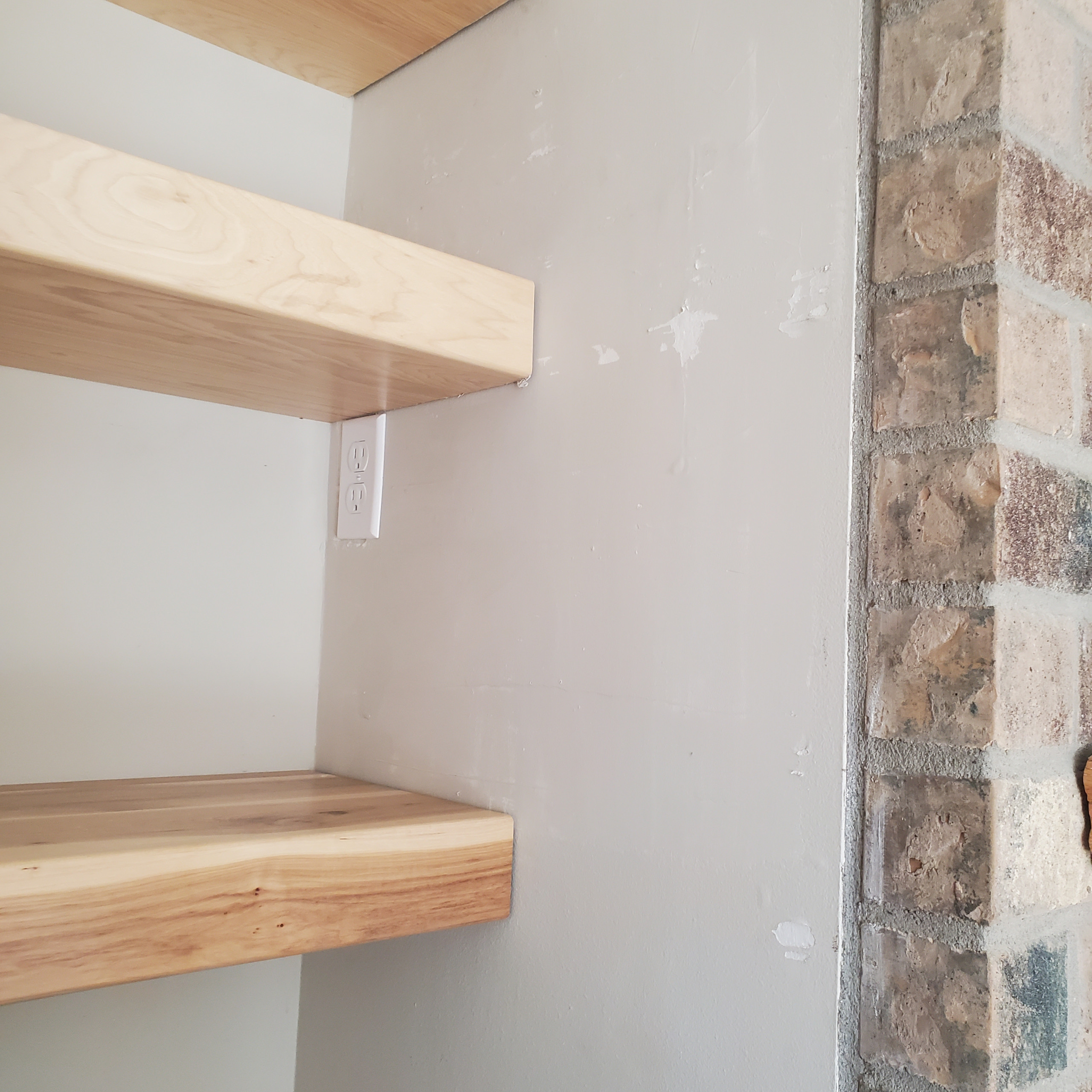 Hickory floating shelves and cabinets