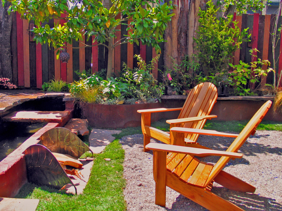 Design ideas for an eclectic garden in Seattle with a water feature.