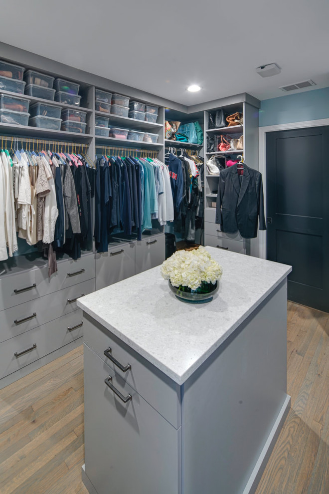 Mid-sized trendy walk-in closet photo in Chicago with flat-panel cabinets and gray cabinets