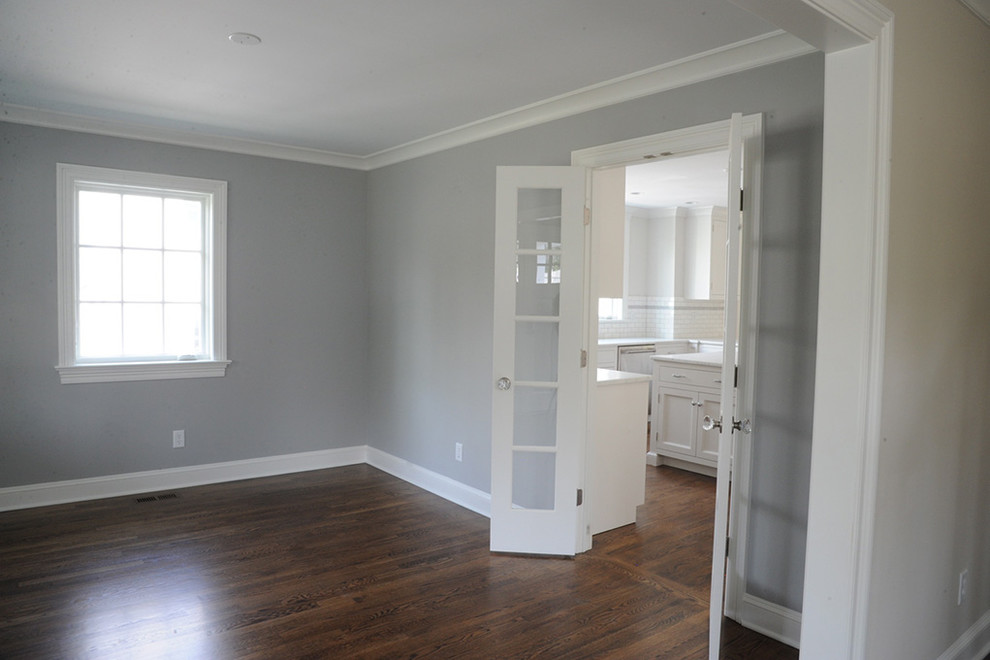 Inspiration for a mid-sized transitional dark wood floor and brown floor enclosed dining room remodel with gray walls