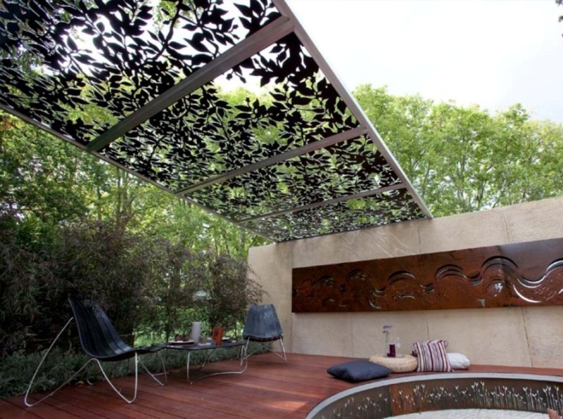 Large eclectic patio in Melbourne with decking and a pergola.