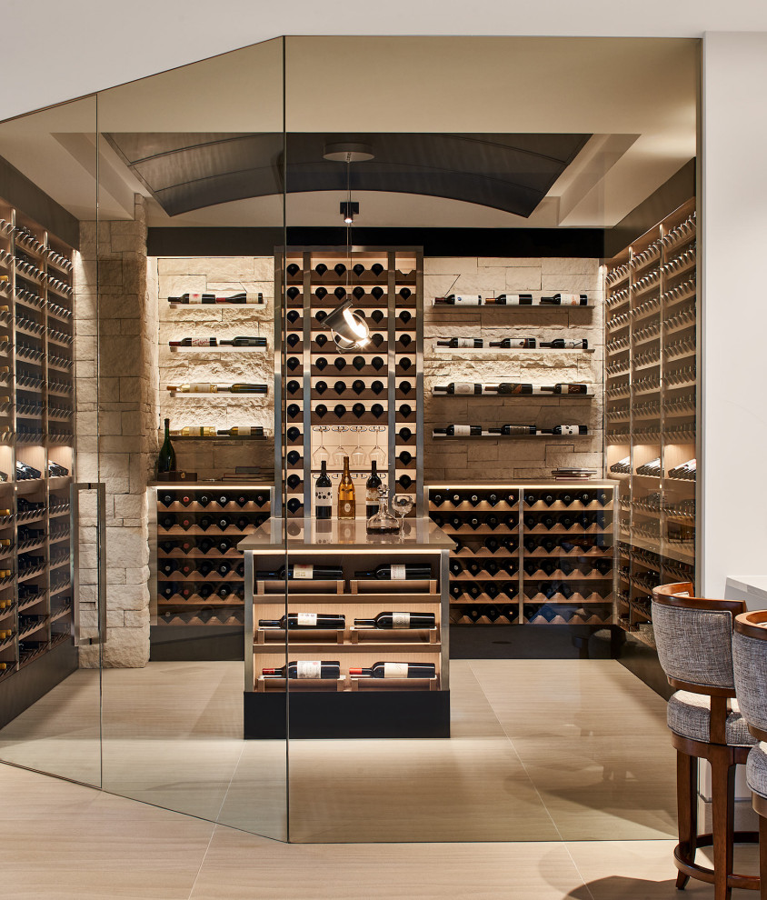 Design ideas for a large mediterranean wine cellar in Denver with diamond bins and beige floor.
