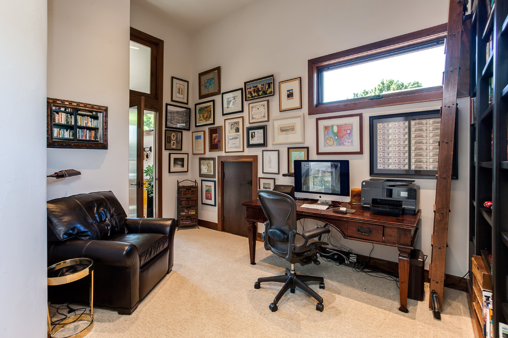 Photo of a mid-sized traditional study room in Denver with beige walls, carpet, no fireplace and a freestanding desk.