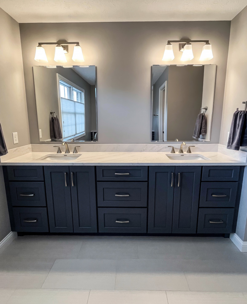 Primary Bathroom with Blue-Gray Vanity and Deep Blue Tiled Feature Wall ...