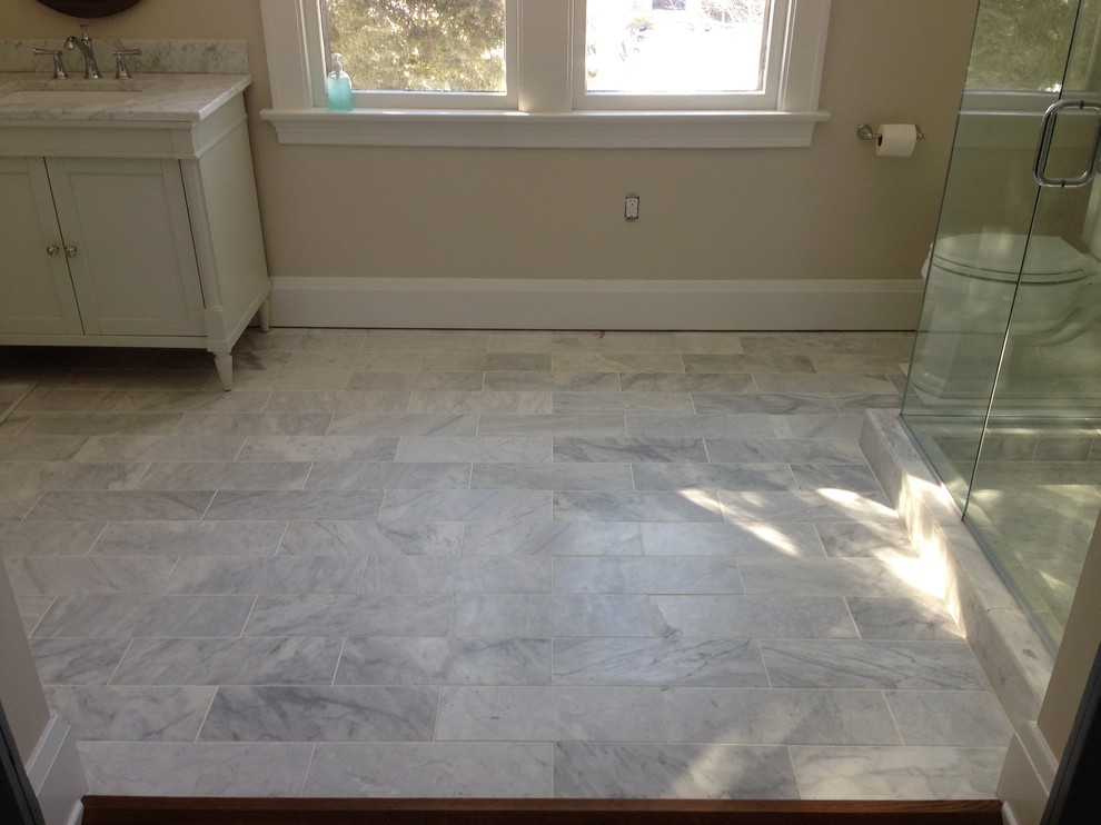 Inspiration for a transitional master white tile and stone tile marble floor corner shower remodel in Cincinnati with a two-piece toilet and beige walls
