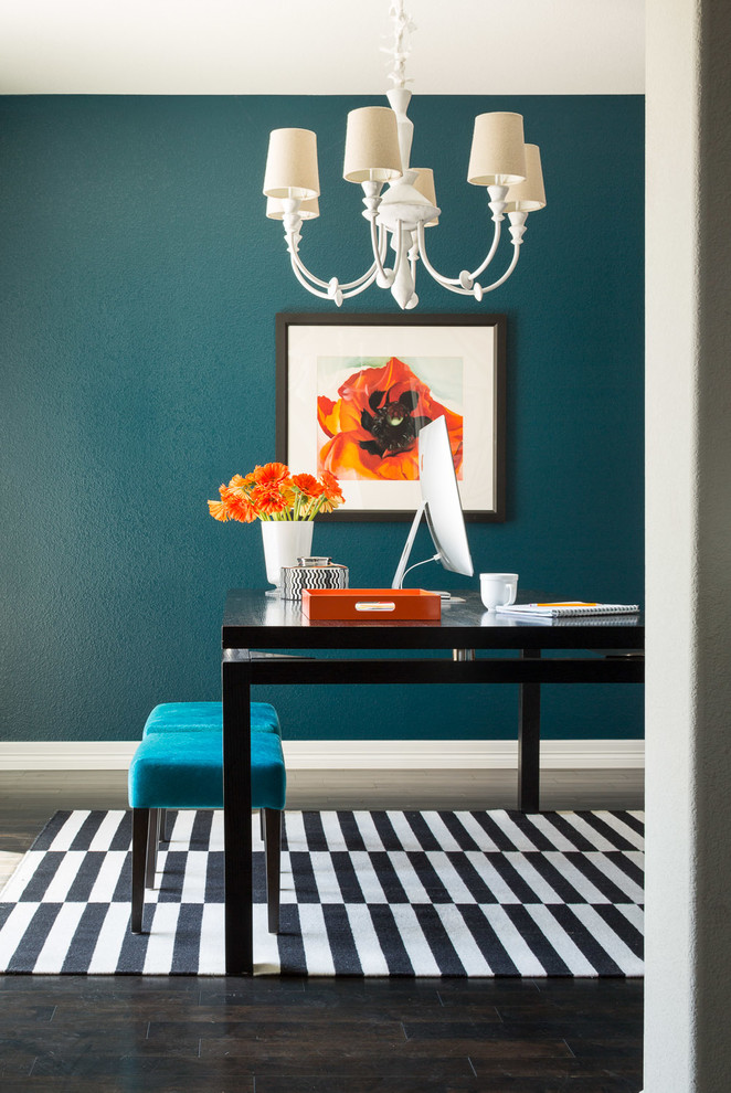 Inspiration for a small eclectic study room in Denver with blue walls, dark hardwood floors and a freestanding desk.