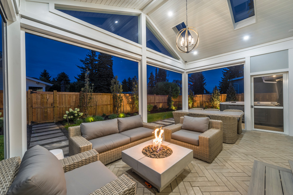 Patio - transitional backyard patio idea in Vancouver with a fire pit