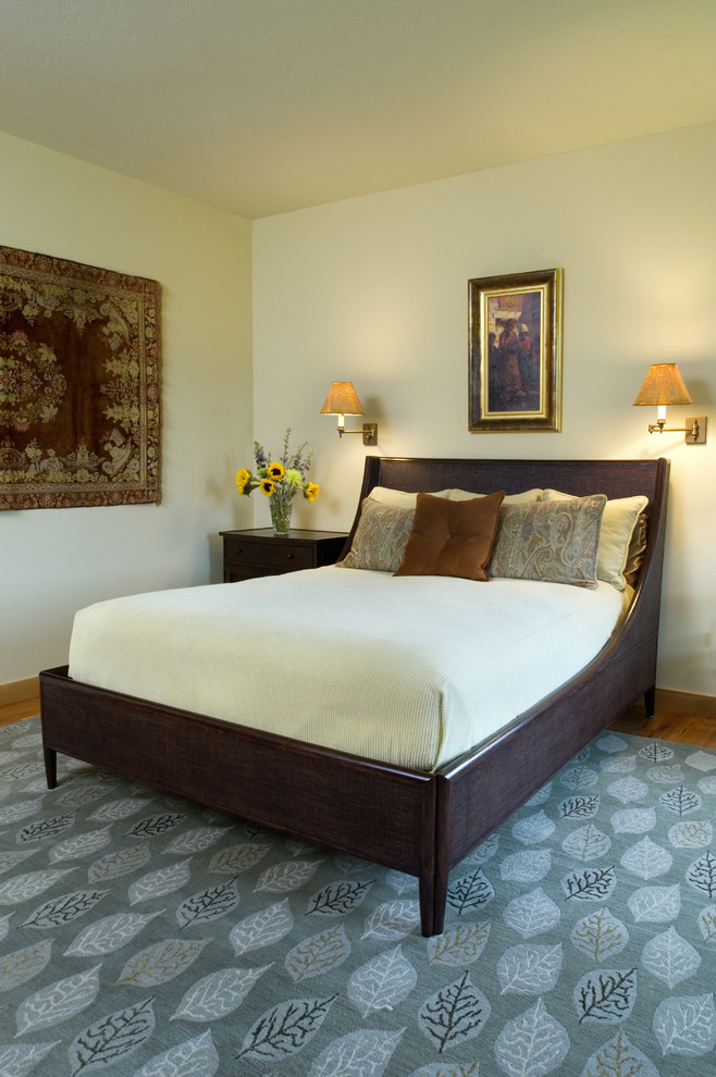 Photo of a traditional bedroom in Other with beige walls.
