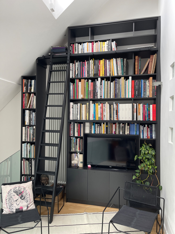 Black spray painted library bookshelf with ladder