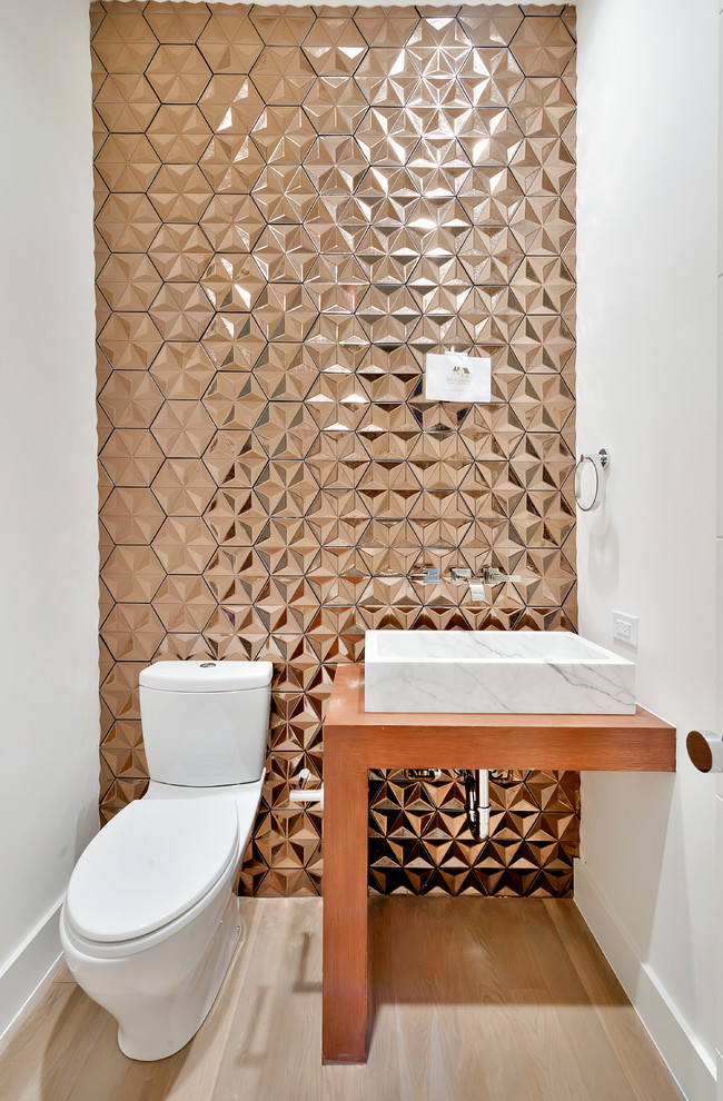 Small modern powder room in Dallas with white walls, light hardwood floors and a vessel sink.