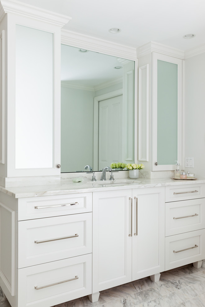 Design ideas for a contemporary master bathroom in Boston with beaded inset cabinets, white cabinets, white tile and marble benchtops.