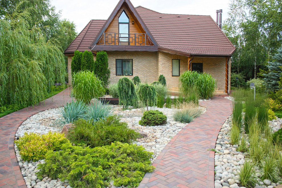 Design ideas for a mid-sized asian courtyard partial sun driveway for summer in Moscow with a garden path and brick pavers.
