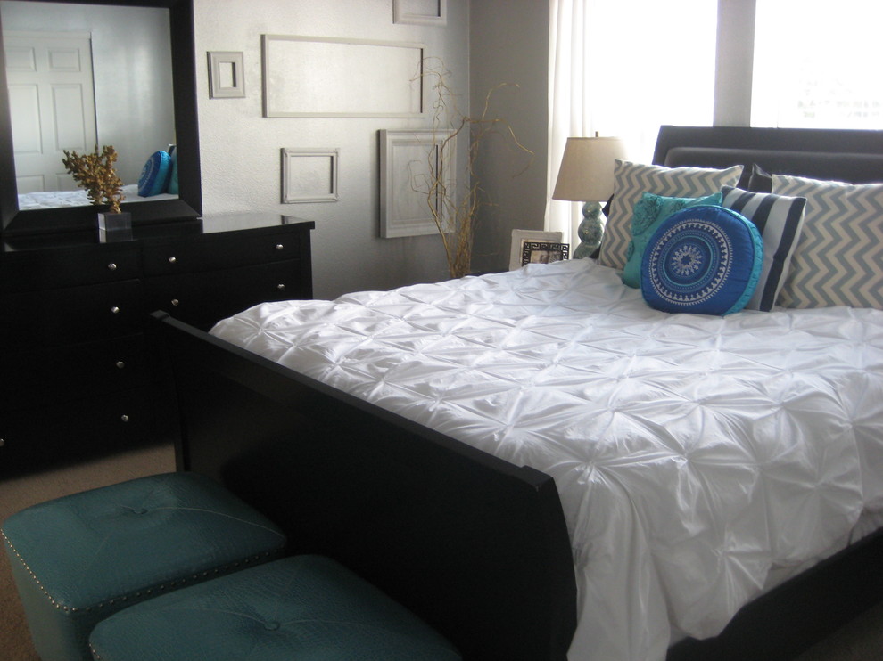 Photo of a transitional bedroom in Portland with grey walls.