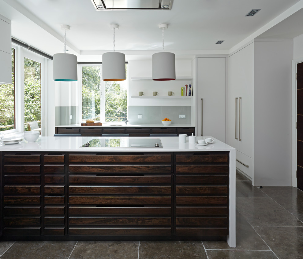 Inspiration for a large contemporary kitchen in Cornwall with a double-bowl sink, flat-panel cabinets, quartz benchtops, grey splashback, glass sheet splashback and stainless steel appliances.