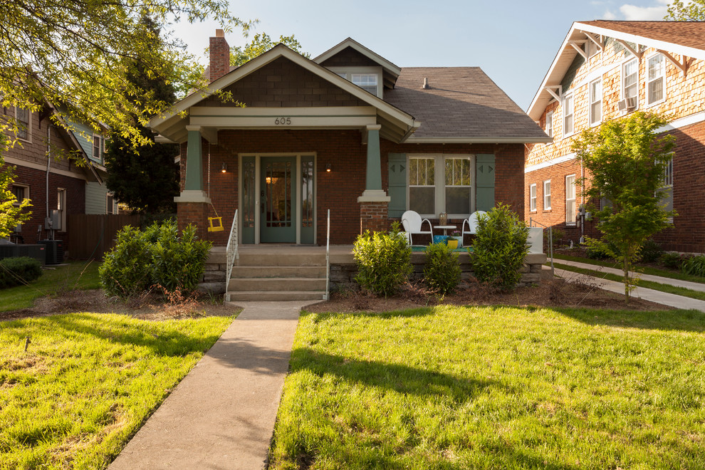 Photo of a mid-sized eclectic two-storey brick brown exterior in Nashville with a gable roof.