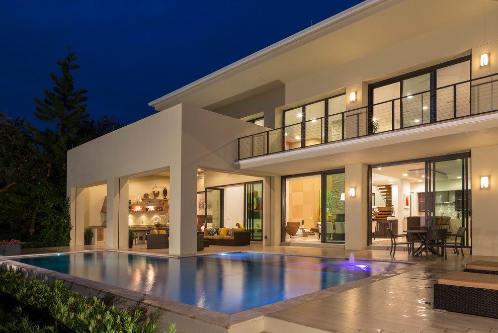 Design ideas for a contemporary backyard custom-shaped pool in Orlando.