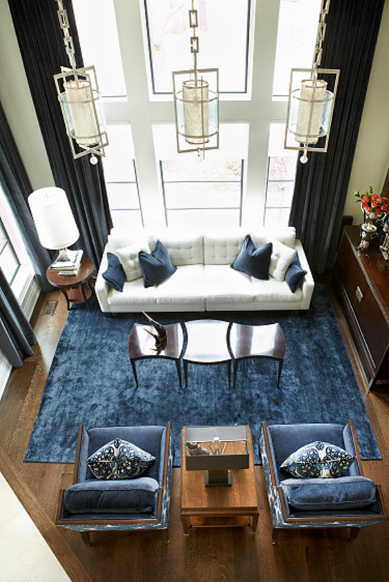 Photo of a large transitional open concept living room in Toronto with dark hardwood floors.