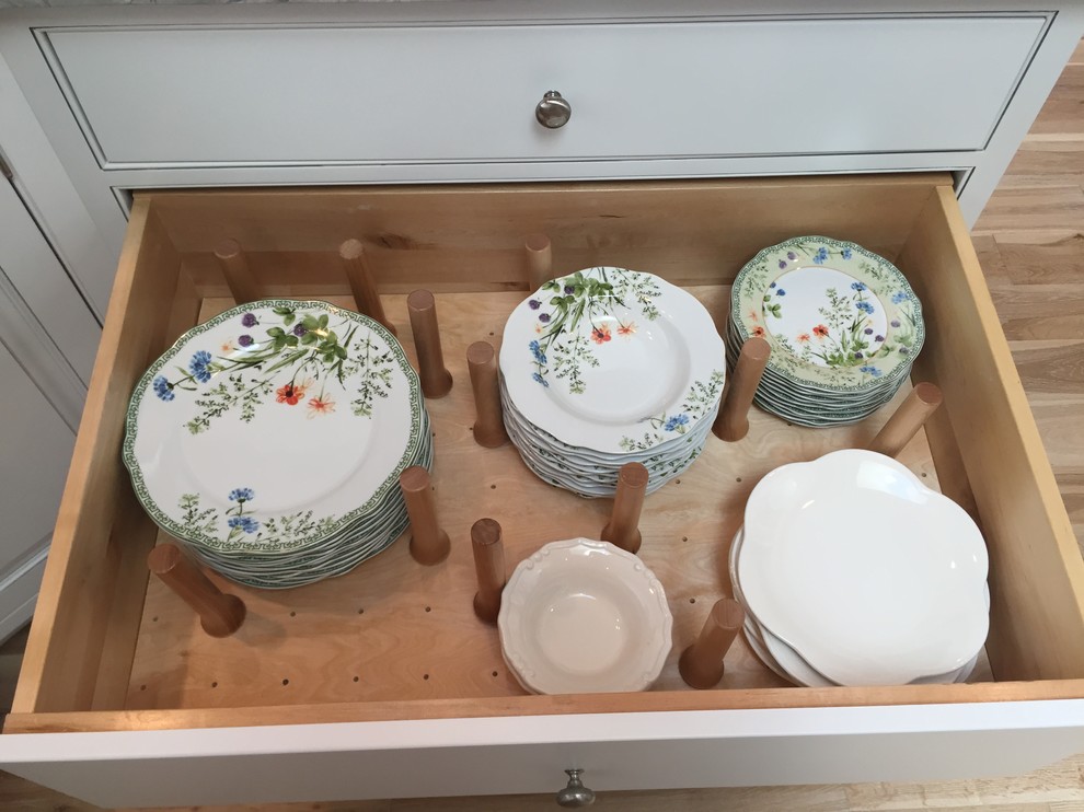 Inspiration for a large transitional u-shaped light wood floor open concept kitchen remodel with an undermount sink, beaded inset cabinets, white cabinets, white appliances and a peninsula