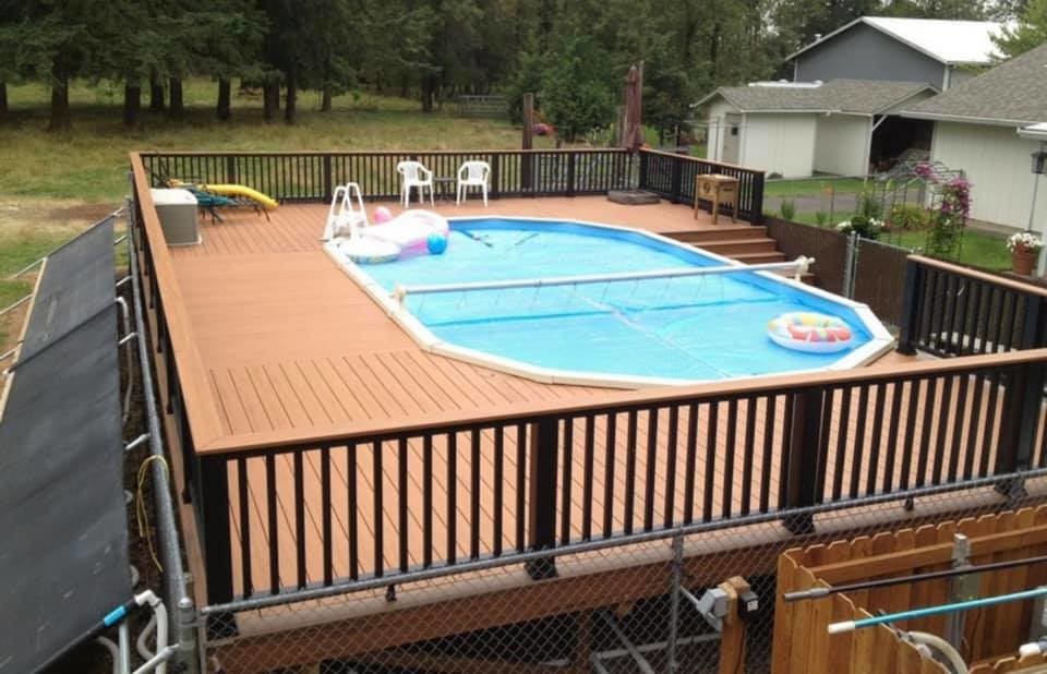 Pool - large transitional custom-shaped aboveground pool idea with decking