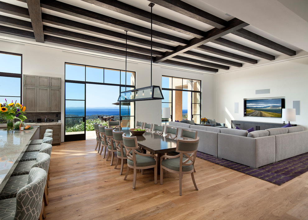 Photo of an expansive contemporary open plan dining in Santa Barbara with white walls, medium hardwood floors and no fireplace.