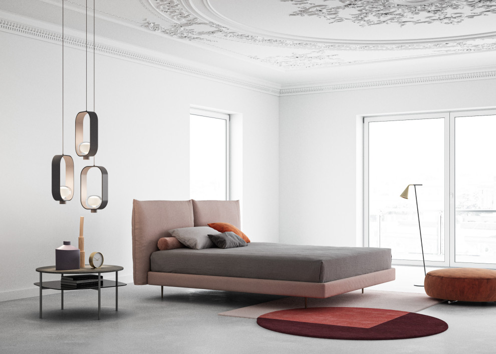 Large contemporary mezzanine and grey and pink bedroom in Milan with white walls, concrete flooring, white floors and a vaulted ceiling.