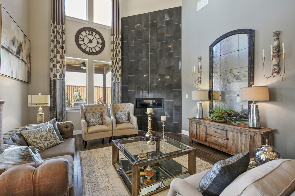 This is an example of a large transitional formal open concept living room in Dallas with beige walls, dark hardwood floors, a corner fireplace, a tile fireplace surround, brown floor and no tv.