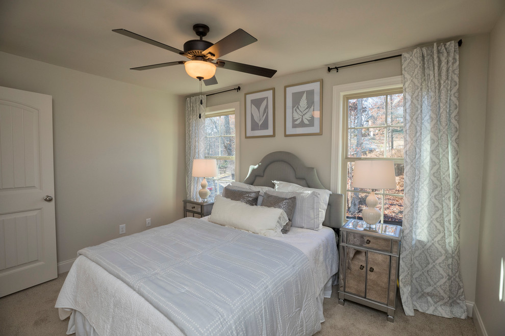 Design ideas for a mid-sized traditional master bedroom in Birmingham with beige walls, carpet and no fireplace.