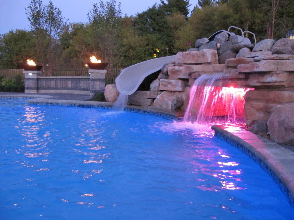 Hot tub - transitional backyard brick and custom-shaped hot tub idea in Detroit