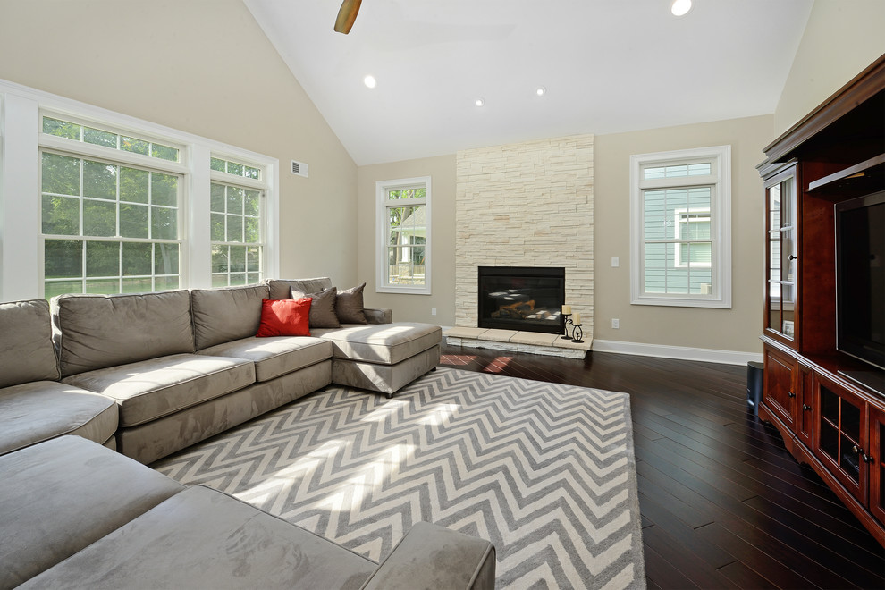 Design ideas for a contemporary formal open concept living room in New York with beige walls and a standard fireplace.