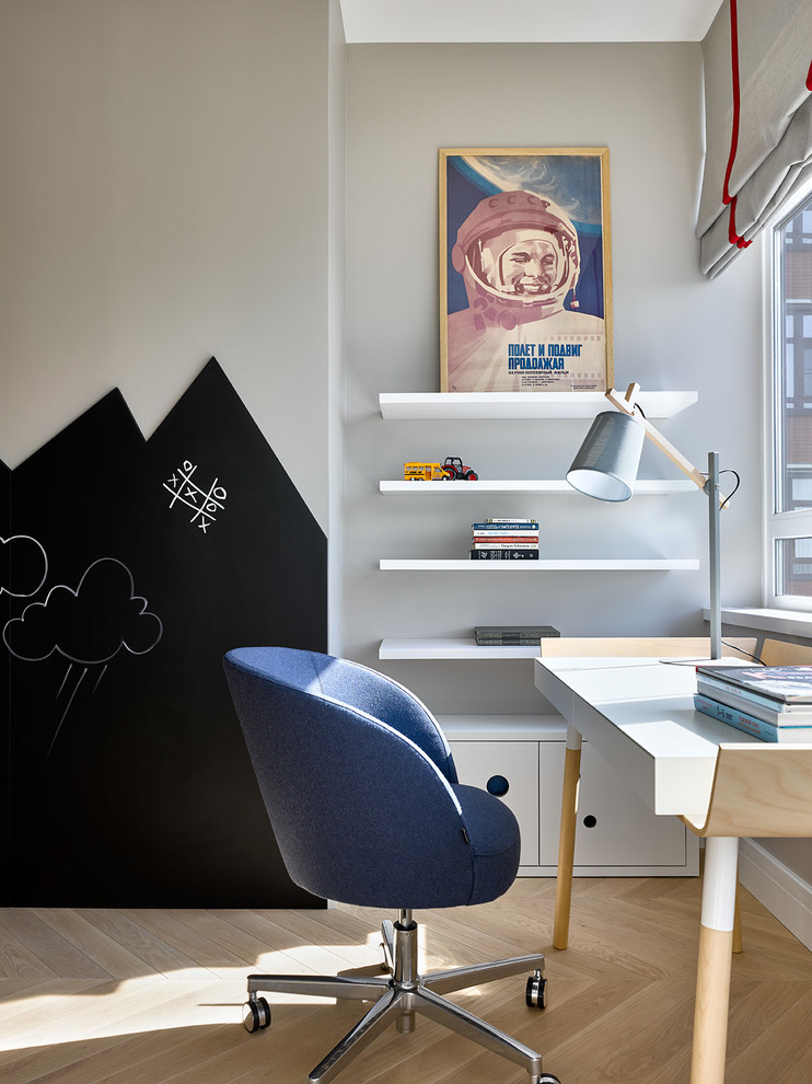 This is an example of a mid-sized contemporary gender-neutral kids' study room for kids 4-10 years old in Moscow with grey walls, light hardwood floors and beige floor.