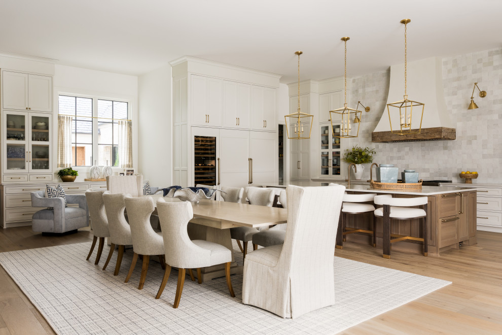 Large cottage light wood floor dining room photo in Dallas with white walls