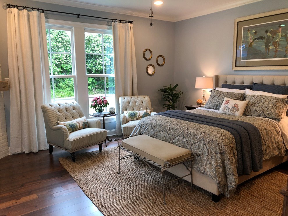 Design ideas for a large transitional master bedroom in New Orleans with blue walls, dark hardwood floors, a ribbon fireplace, a brick fireplace surround and brown floor.