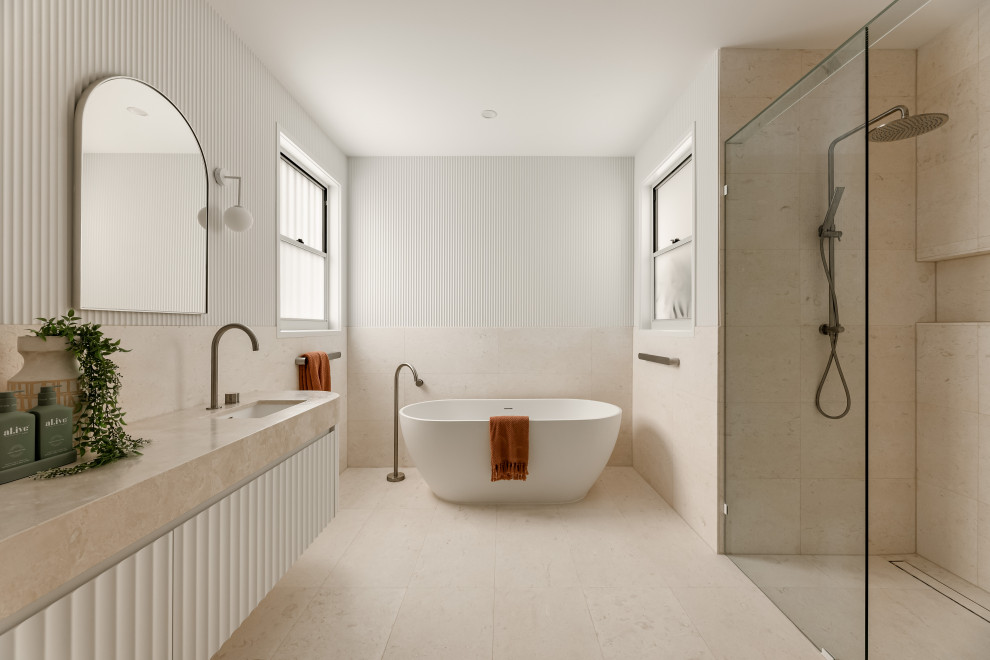 Design ideas for a modern master bathroom in Brisbane with white cabinets, a freestanding tub, beige tile, white walls, an undermount sink, beige floor, beige benchtops, a double vanity, a floating vanity, an alcove shower and an open shower.